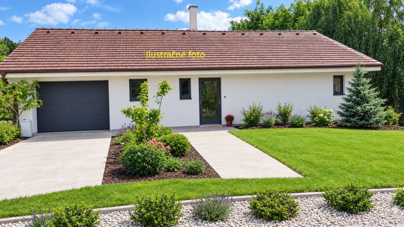 A family house in Ratnovce with a well-maintained garden and a garage, surrounded by greenery.