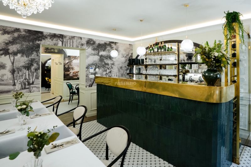 A stylish bar with decorative elements and tables in commercial premises.