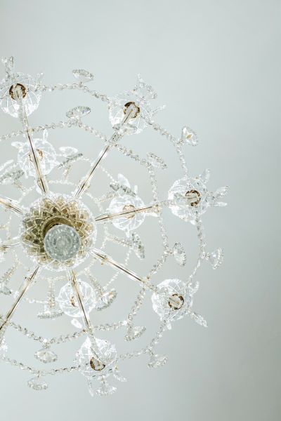 Luxurious crystal chandelier with intricate details in commercial spaces.