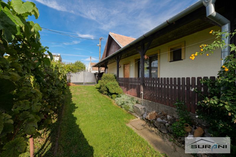 A family house on Hlavná Street in Štefanová with a well-maintained garden and a wooden fence.