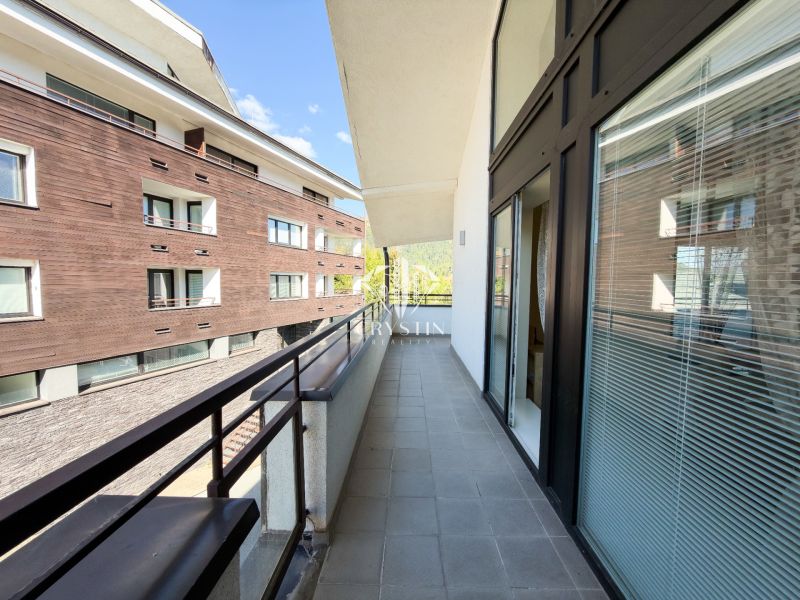 A balcony of a 3-room apartment in Donovaly on Donovaly Street, with a view of the neighboring buildings.