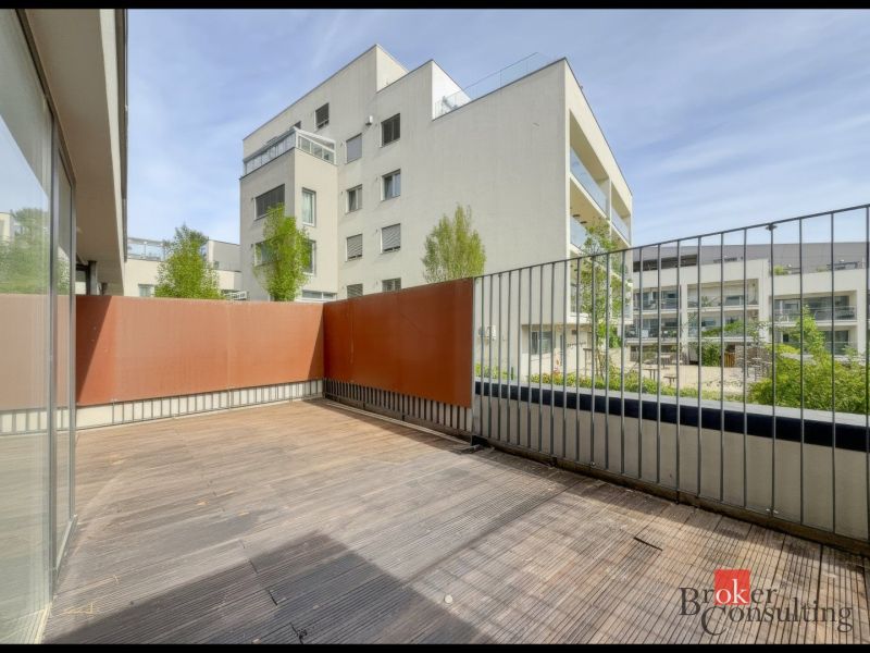 Terrace of a 2-room apartment with a wooden decor floor, surrounding apartment buildings, Svätovavrinecká, Bratislava-Nové Mesto.