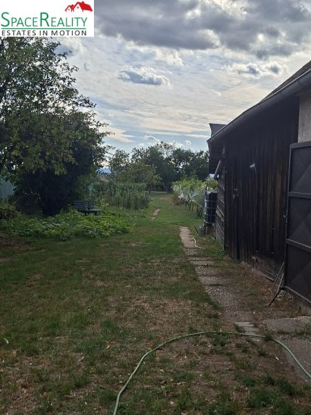 Garden with lawn and pathway on Hlavná Street in Viničné, Residential plots.