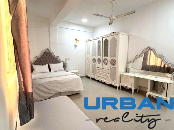 A spacious bedroom with elegant furniture in a 2-room apartment.