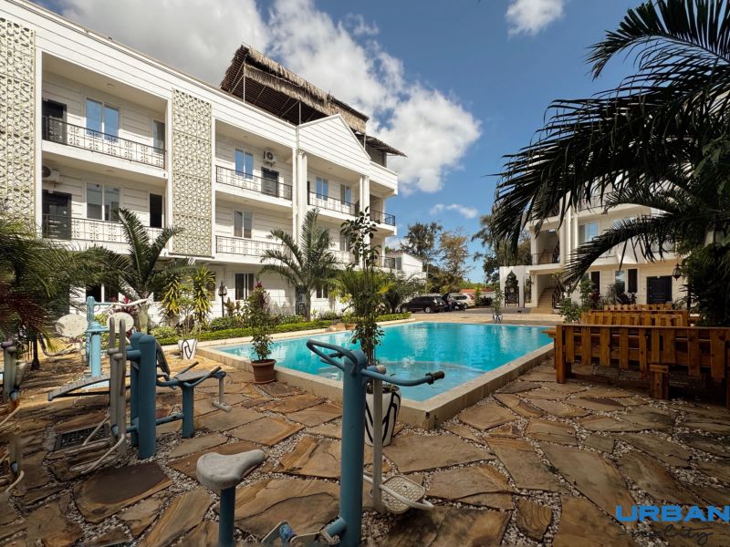 Swimming pool and fitness facilities in the premises of a 2-bedroom apartment in Zanzibar Mbweni.