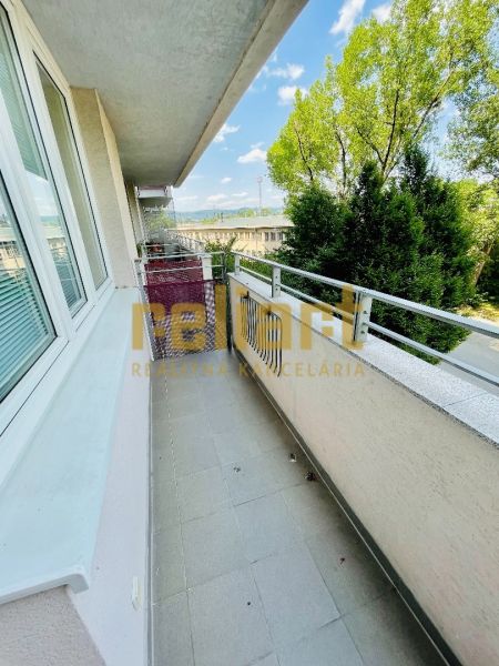 The balcony of a 1-room apartment on Tomášikova Street in Bratislava - Nové Mesto with a view of greenery.
