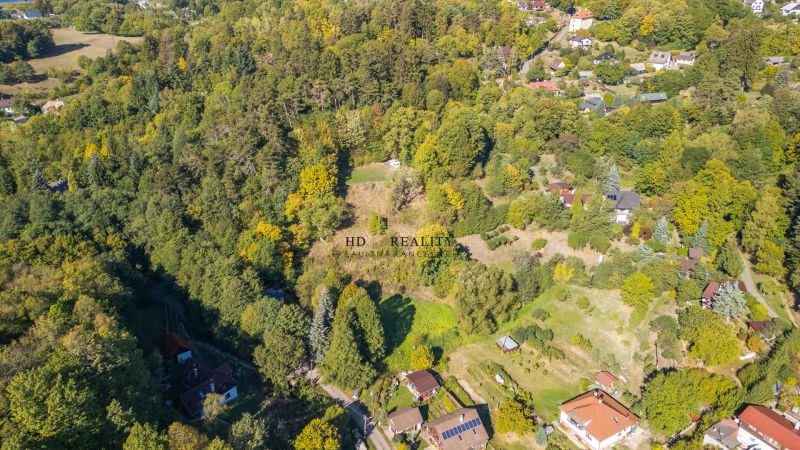 Aerial view of Recreational plots in Štiavnické Bane surrounded by forest and nature.