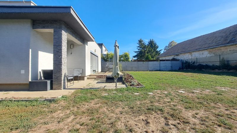 Family house in Horné Saliby with a terrace and a large garden on a sunny plot.