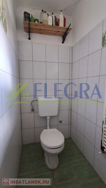 A small bathroom in a family house with simple equipment.