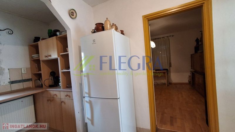 A kitchen in a family house with a wooden decor.