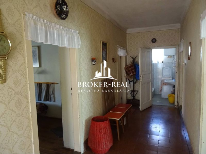 A hallway in a family house with antique furniture and vintage decorations.